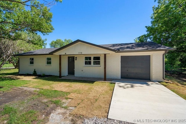 1118 E 131st St S, Jenks, OK 74037 - ranch-style home with a garage, concrete driveway, a front yard, and brick siding