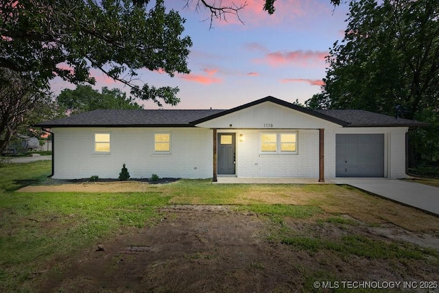 1118 E 131st St S, Jenks, OK 74037 - single story home featuring concrete driveway, a garage, brick siding, and a lawn