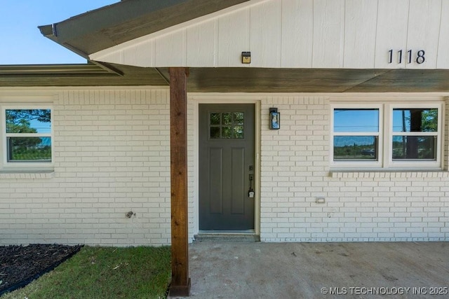 1118 E 131st St S, Jenks, OK 74037 - doorway to property featuring brick siding