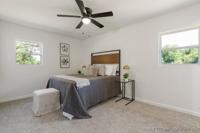 1118 E 131st St S, Jenks, OK 74037 - carpeted bedroom with multiple windows, baseboards, and a ceiling fan