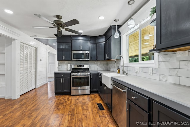 2982 S 294th E Ave, Broken Arrow, OK 74014 - kitchen featuring appliances with stainless steel finishes, a sink, a ceiling fan, decorative backsplash, and recessed lighting