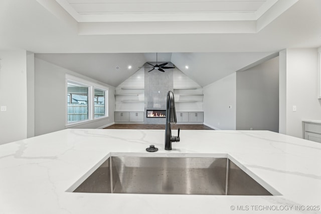 23250 E 106th Pl S, Broken Arrow, OK 74014 - kitchen with a sink, open floor plan, light stone countertops, ceiling fan, and lofted ceiling
