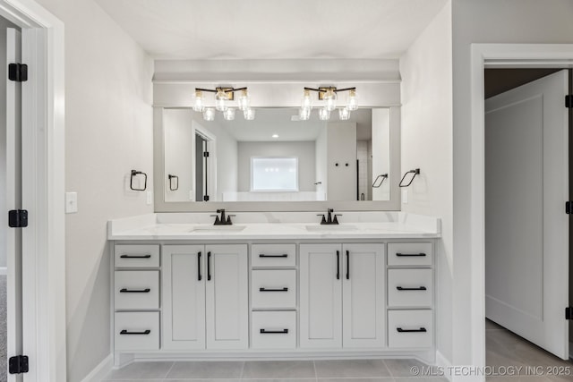 23250 E 106th Pl S, Broken Arrow, OK 74014 - bathroom featuring tile patterned floors, double vanity, a chandelier, and baseboards