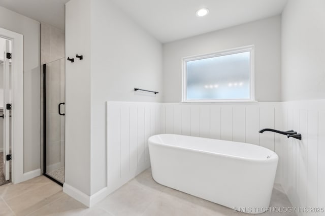 23250 E 106th Pl S, Broken Arrow, OK 74014 - bathroom with wainscoting, a stall shower, a freestanding tub, tile patterned flooring, and recessed lighting