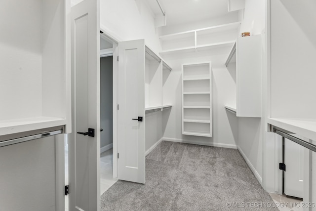23250 E 106th Pl S, Broken Arrow, OK 74014 - walk in closet featuring light colored carpet