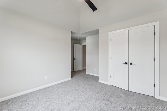 23250 E 106th Pl S, Broken Arrow, OK 74014 - unfurnished bedroom with baseboards, carpet floors, a closet, ceiling fan, and lofted ceiling