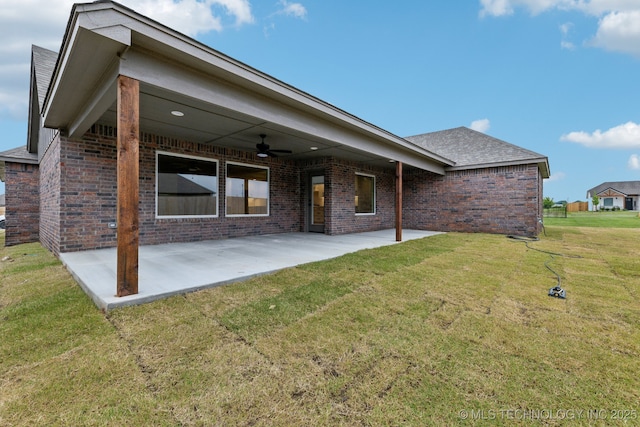 23250 E 106th Pl S, Broken Arrow, OK 74014 - rear view of property with brick siding, ceiling fan, a patio, and a lawn