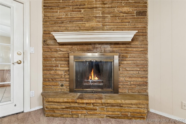 8805 E 46th Pl, Tulsa, OK 74145 - detailed view of carpet, a glass covered fireplace, and baseboards