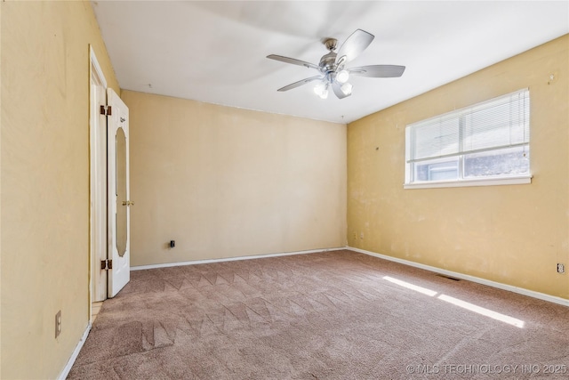 8805 E 46th Pl, Tulsa, OK 74145 - carpeted spare room with ceiling fan and baseboards