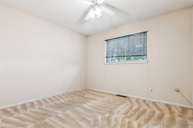 8805 E 46th Pl, Tulsa, OK 74145 - spare room with baseboards, carpet, and ceiling fan