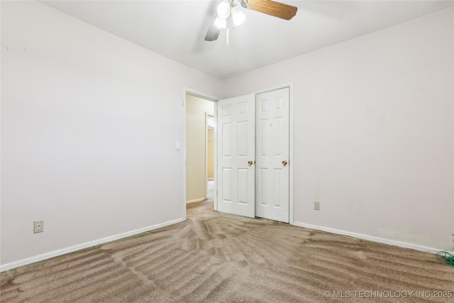 8805 E 46th Pl, Tulsa, OK 74145 - unfurnished bedroom with carpet flooring, baseboards, and a ceiling fan
