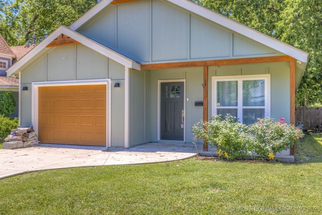 110 S Birch St, Sapulpa, OK 74066 - view of front facade featuring board and batten siding, a garage, a front yard, and concrete driveway