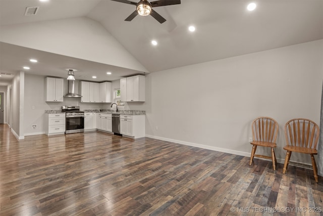 110 S Birch St, Sapulpa, OK 74066 - kitchen featuring stainless steel appliances, wall chimney exhaust hood, a ceiling fan, dark wood-style flooring, and recessed lighting
