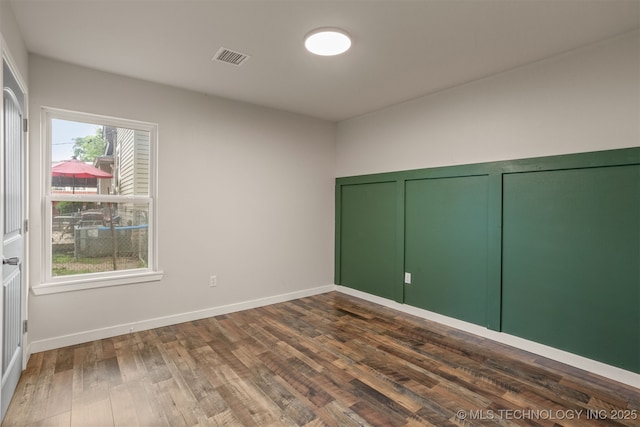 110 S Birch St, Sapulpa, OK 74066 - unfurnished bedroom featuring dark wood finished floors