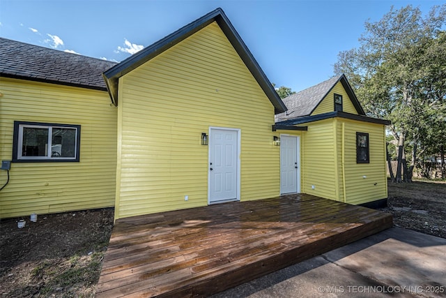 731 8th Ave NW, Ardmore, OK 73401 - rear view of house featuring a wooden deck