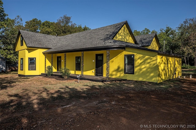 731 8th Ave NW, Ardmore, OK 73401 - view of front of property with roof with shingles and a porch