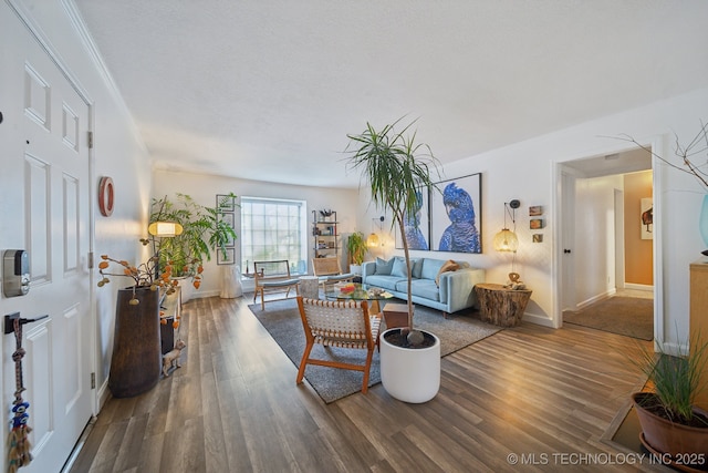 4428 E 68th St Unit 484, Tulsa, OK 74136 - living room featuring wood finished floors and baseboards