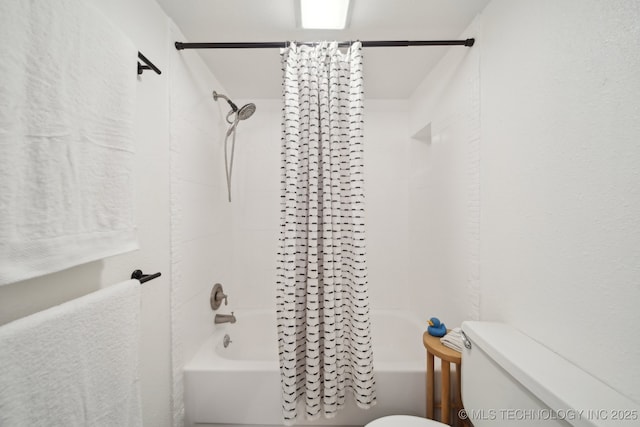 4428 E 68th St Unit 484, Tulsa, OK 74136 - bathroom featuring toilet and shower / bath combo with shower curtain