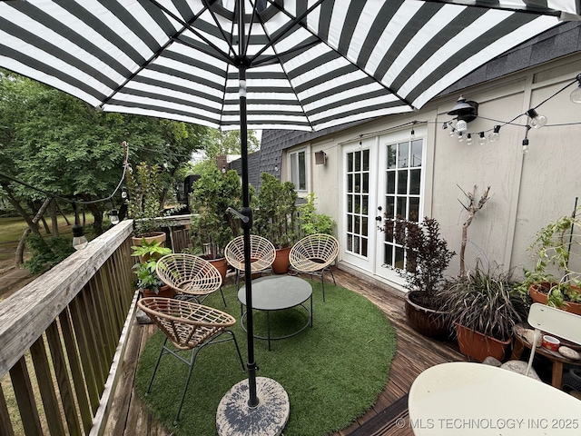 4428 E 68th St Unit 484, Tulsa, OK 74136 - view of wooden balcony featuring french doors and a wooden deck