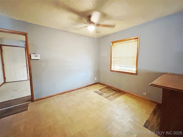 303 W Mckinley Ave, Sapulpa, OK 74066 - unfurnished room featuring a ceiling fan, baseboards, and tile patterned floors