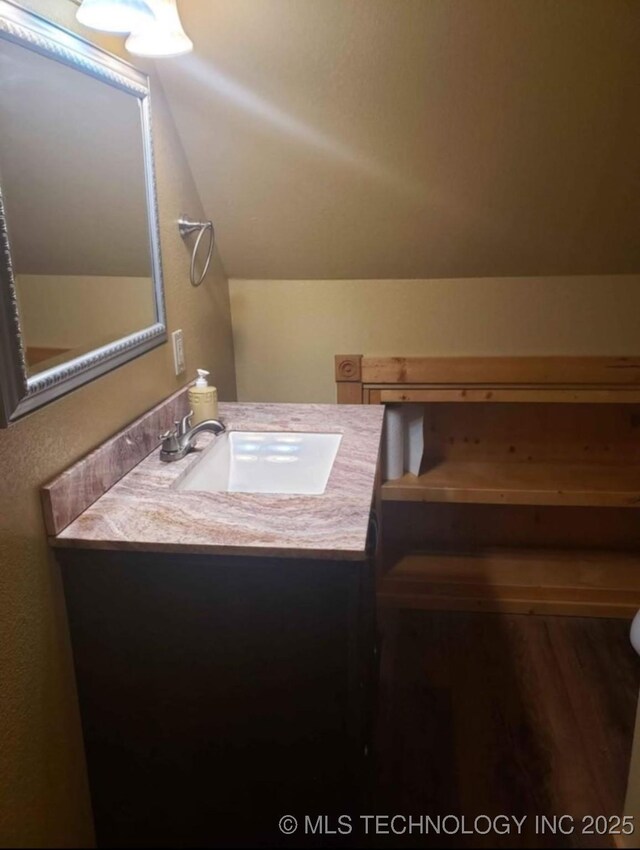 452176 E 958th Rd, Vian, OK 74962 - bathroom featuring vanity and vaulted ceiling