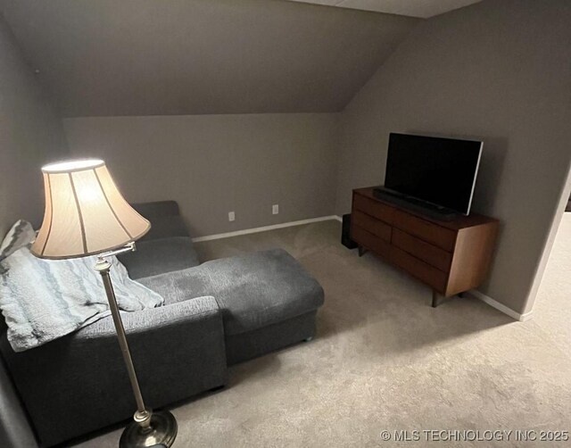 19416 E 38th St S, Broken Arrow, OK 74014 - living room featuring carpet floors, lofted ceiling, and baseboards
