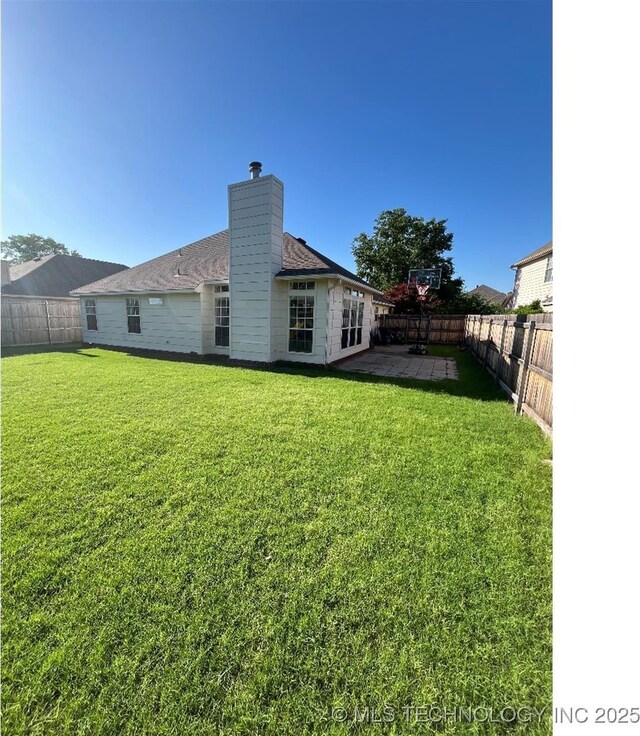 19416 E 38th St S, Broken Arrow, OK 74014 - back of property featuring a chimney and a patio area