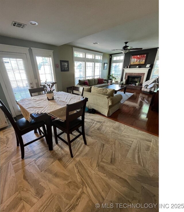 19416 E 38th St S, Broken Arrow, OK 74014 - dining space with a fireplace, ceiling fan, and recessed lighting