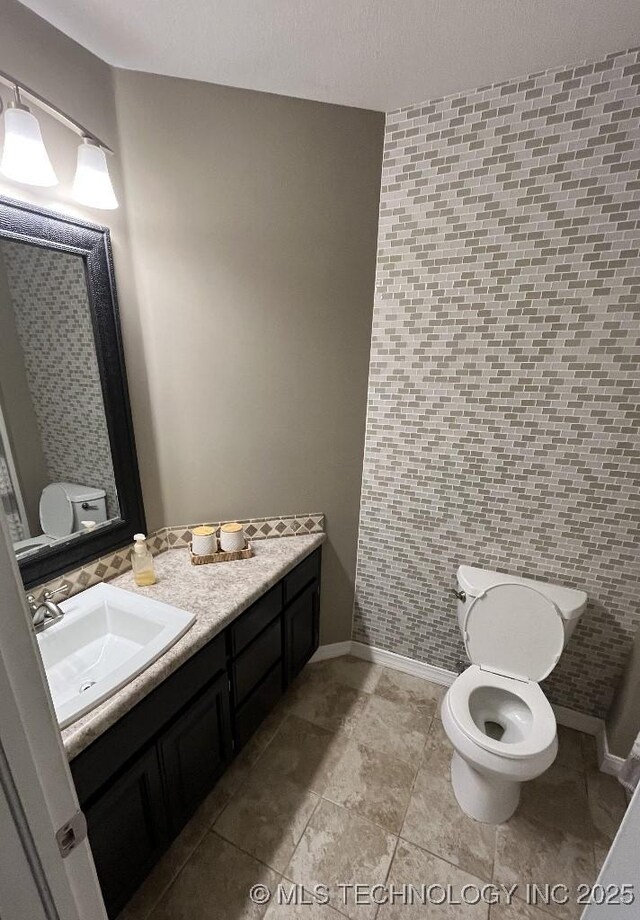 19416 E 38th St S, Broken Arrow, OK 74014 - half bath with toilet, vanity, baseboards, and tile patterned flooring