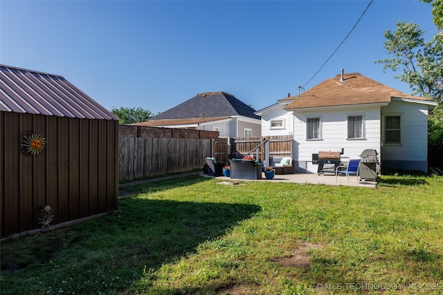 317 E 4th St, Claremore, OK 74017 - rear view of house with a patio area and an outdoor hangout area