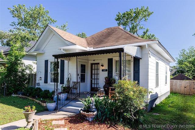 317 E 4th St, Claremore, OK 74017 - view of front of house featuring a porch and a shingled roof