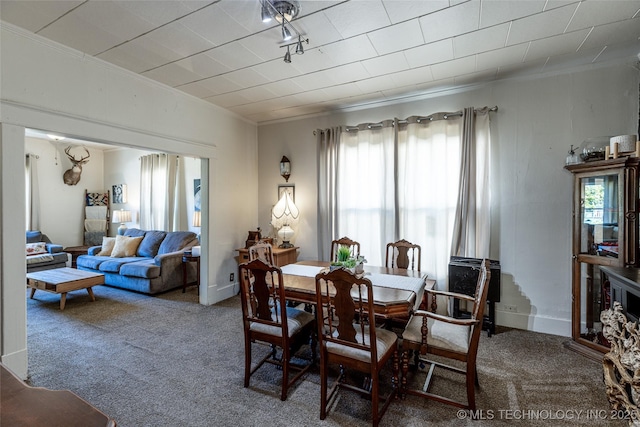 317 E 4th St, Claremore, OK 74017 - carpeted dining space with crown molding