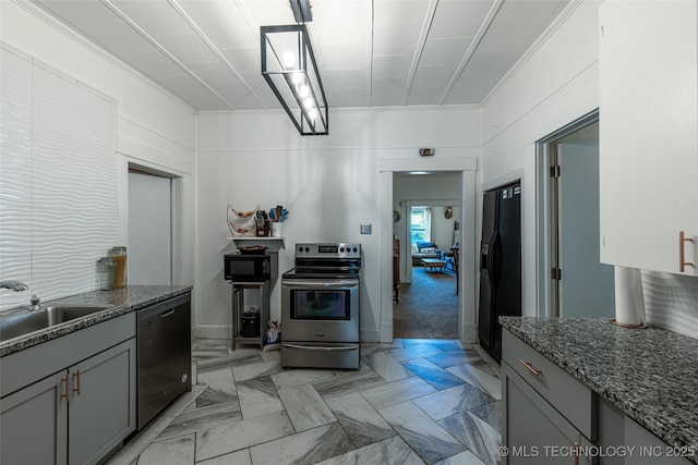 317 E 4th St, Claremore, OK 74017 - kitchen featuring black appliances, a sink, gray cabinetry, dark stone countertops, and ornamental molding