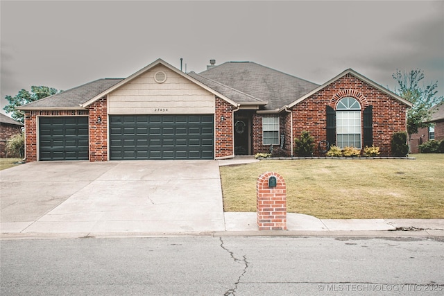 27434 E 113th St, Coweta, OK 74429 - ranch-style home featuring an attached garage, a front lawn, concrete driveway, and brick siding