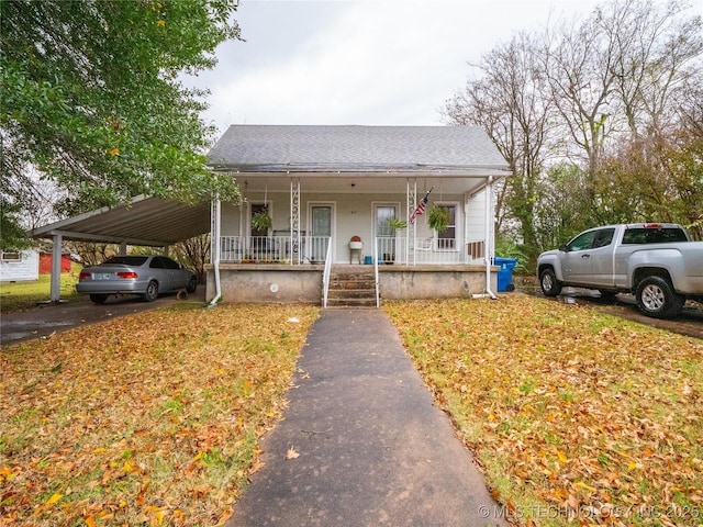 611 N Hickory, Mcalester, OK 74501 - bungalow-style home featuring a porch, a shingled roof, and an attached carport