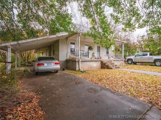 611 N Hickory, Mcalester, OK 74501 - view of front facade with covered porch, driveway, and an attached carport