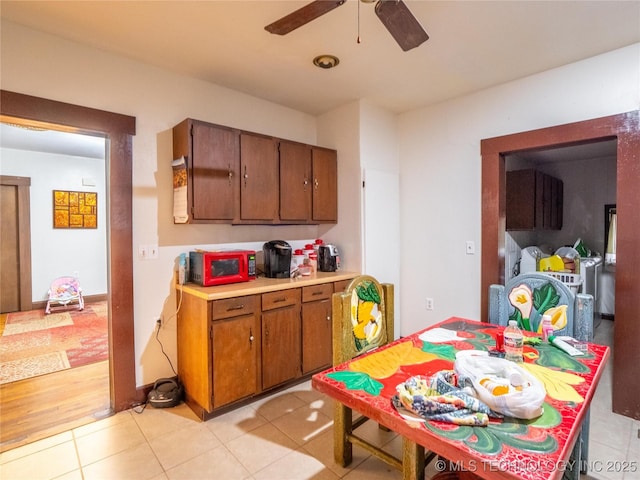 611 N Hickory, Mcalester, OK 74501 - kitchen with brown cabinets, a ceiling fan, light countertops, and light tile patterned floors
