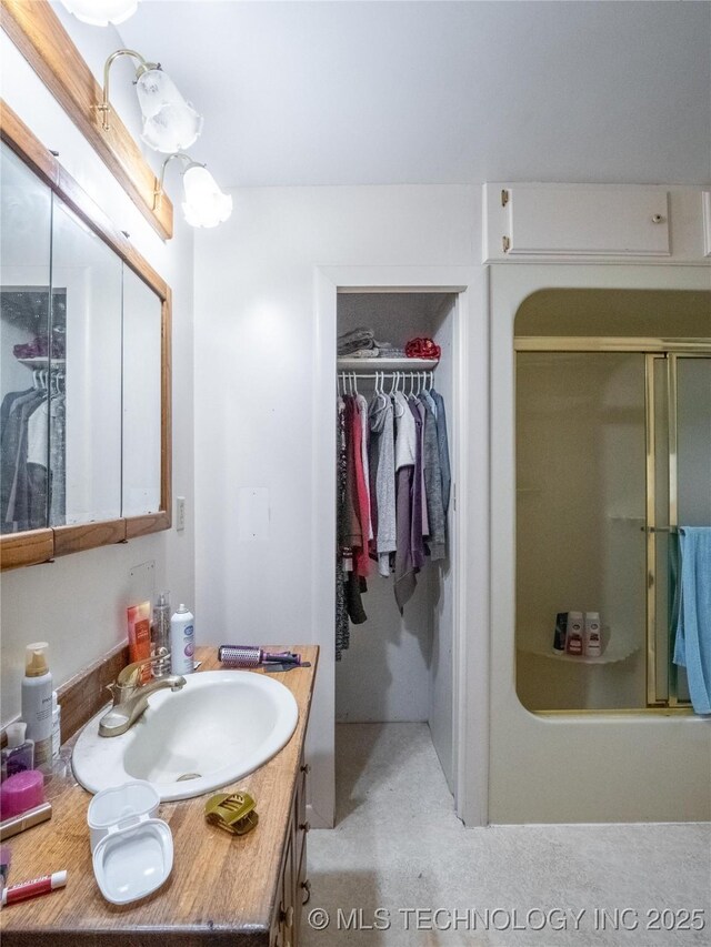 611 N Hickory, Mcalester, OK 74501 - bathroom featuring an enclosed shower, vanity, a spacious closet, and a bathtub