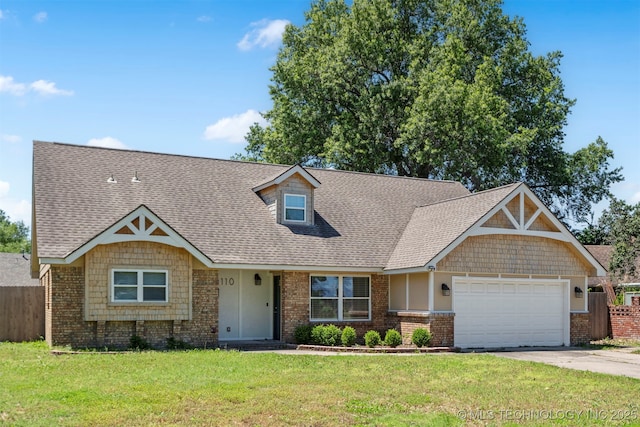 9110 E 37th Ct, Tulsa, OK 74145 - view of front of house featuring an attached garage, concrete driveway, brick siding, and a shingled roof