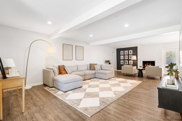 9110 E 37th Ct, Tulsa, OK 74145 - living room with beamed ceiling, light wood-type flooring, baseboards, recessed lighting, and a large fireplace