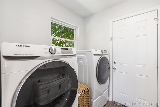 9110 E 37th Ct, Tulsa, OK 74145 - laundry room featuring washing machine and dryer and wood finished floors