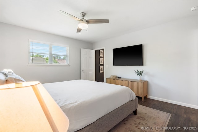 9110 E 37th Ct, Tulsa, OK 74145 - bedroom featuring wood finished floors, baseboards, and a ceiling fan