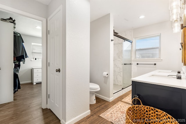 9110 E 37th Ct, Tulsa, OK 74145 - full bathroom featuring a stall shower, wood finished floors, toilet, vanity, and recessed lighting
