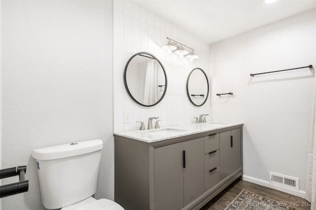 9110 E 37th Ct, Tulsa, OK 74145 - full bath with toilet, wood finished floors, and double vanity