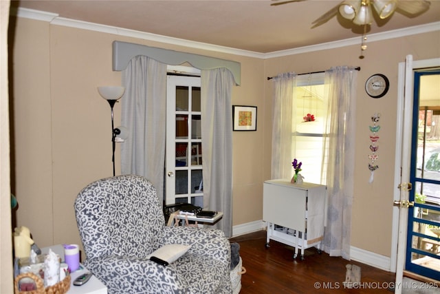 805 W Cummings St, Henryetta, OK 74437 - sitting room featuring crown molding, healthy amount of natural light, a ceiling fan, wood finished floors, and baseboards