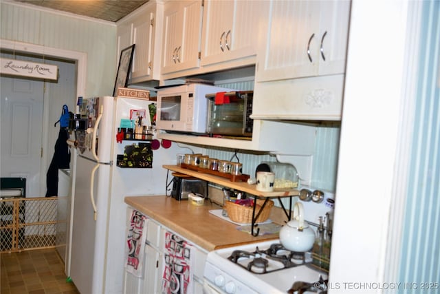 805 W Cummings St, Henryetta, OK 74437 - kitchen featuring white appliances and light countertops