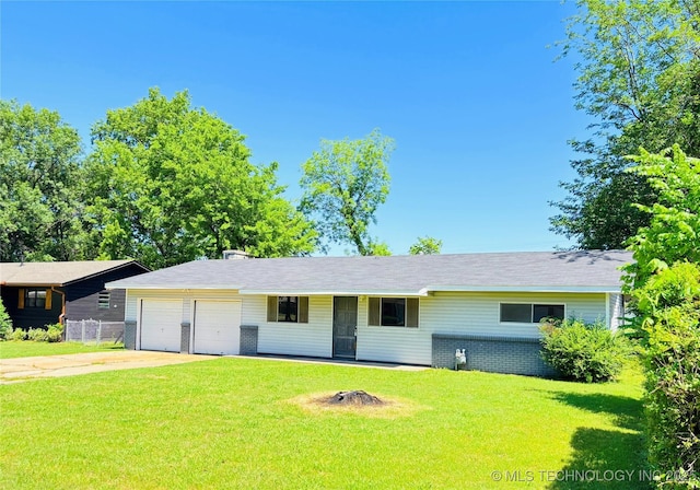 1107 SE 5th St, Wagoner, OK 74467 - ranch-style house with an attached garage and concrete driveway