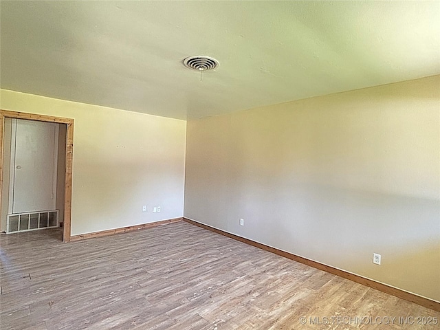 1107 SE 5th St, Wagoner, OK 74467 - empty room featuring wood finished floors and baseboards