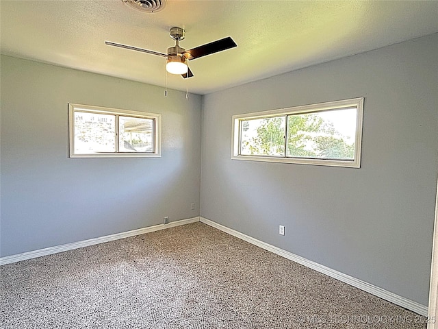1107 SE 5th St, Wagoner, OK 74467 - carpeted empty room with ceiling fan and baseboards