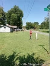 412 W Elm St, Fort Gibson, OK 74434 - view of property's community with a yard